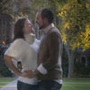 couple embrace under archway